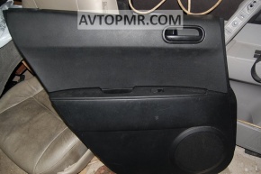 Обшивка дверей картка зад лев Mazda CX-7 06-09 чорна