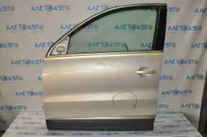 Дверь голая передняя левая VW Tiguan 09-17 серебро LA7W, легкая вмятина