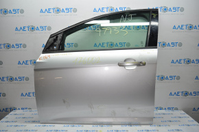 Дверь голая передняя левая Ford Focus mk3 11-18 серебро UX вмятинка