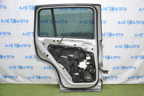 Дверь голая задняя левая VW Tiguan 09-17 серебро LA7W тычки, крашенная