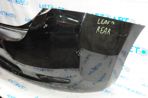 Бампер задній голий Nissan Leaf 13-17 чорний, зламано креп, притиснутий, подряпини, надриви