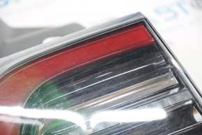 Ліхтар зовнішній крило лівий Tesla Model 3 18- USA 3 піна дрібні подряпини, скол, плями на пластиці