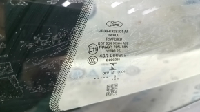 Маркировка стекла форточки для Ford, подтверждающая оригинальность детали.