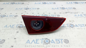 Фонарь внутренний крышка багажника левый Mazda 3 19-22 4d тип 1 под полировку