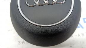 Фронтальная часть airbag Audi A5 с заметными потертостями.