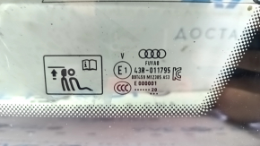 Маркировка и оригинальный номер на стекле Audi, подтверждающие оригинальность детали.