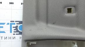 Поперечная часть обшивки потолка BMW X5 F15, заметны следы использования.
