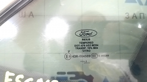 Маркировка на стекле задней правой форточки Ford Escape 2020 года, подтверждающая оригинальность