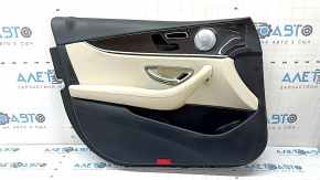 Обшивка двери карточка передняя левая Mercedes W213 E 17-23 кожа черная, вставка бежевая кожа, подлокотник бежевая кожа, без шторки, вставка под темное дерево, Burmester, с накладками и ручкой, тычки,