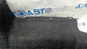 Крупный план обшивки от Toyota Camry V50, в черном цвете с небольшими потертостями.