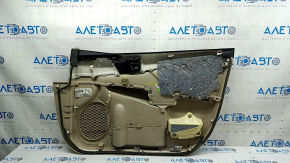Деталь обшивки двери передняя левая Toyota Camry, с ручкой и подлокотником, вид с внутренней стороны.