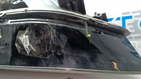 Фара передняя левая Tesla Model X 16-21 UP-LEVEL песок, сломана направляйка