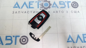 Комплект ключа BMW 3 F30 с механическим ключом, вид спереди, видно состояние использования.