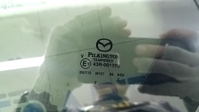 Маркировка стекла Pilkington на форточке Mazda CX-50 2023.