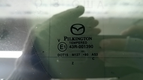 Маркировка стекла Pilkington для Mazda CX-50, подтверждающая оригинальность.
