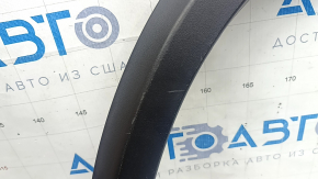 Изображение показывает состояние накладки арки крыла передней левой для Infiniti QX50 с естественными следами износа.