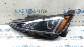 Фара передня ліва Hyundai Elantra AD 19-20 галоген з кронштейнами та накладкою, пісок