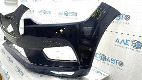 Общий вид переднего бампера Volvo XC60 с заметными следами эксплуатации и вмятинами.