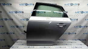 Дверь в сборе задняя левая Audi A4 B9 17-19 серебро LZ7G, keyless, крашена, тычки, вмятина