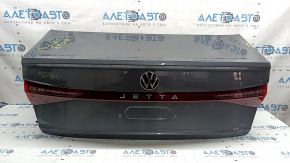 Крышка багажника в сборе VW Jetta 25-26 графит LD7X, с фонарем, обшивкой, отбойниками, замком, эмблемой, ручкой и камерой, царапины