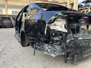 Четверть крыло задняя левая VW Passat b8 16-19 USA на кузове, черная, замята, не заводские отверстия, тычки