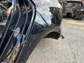 Четверть крыло задняя левая VW Passat b8 16-19 USA на кузове, черная, замята, не заводские отверстия, тычки
