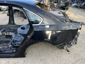 Четверть крыло задняя левая VW Passat b8 16-19 USA на кузове, черная, замята, не заводские отверстия, тычки
