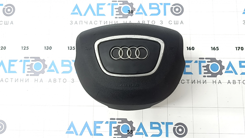 Подушка безопасности руля Audi Q7 2010-2015, вид сверху с логотипом.