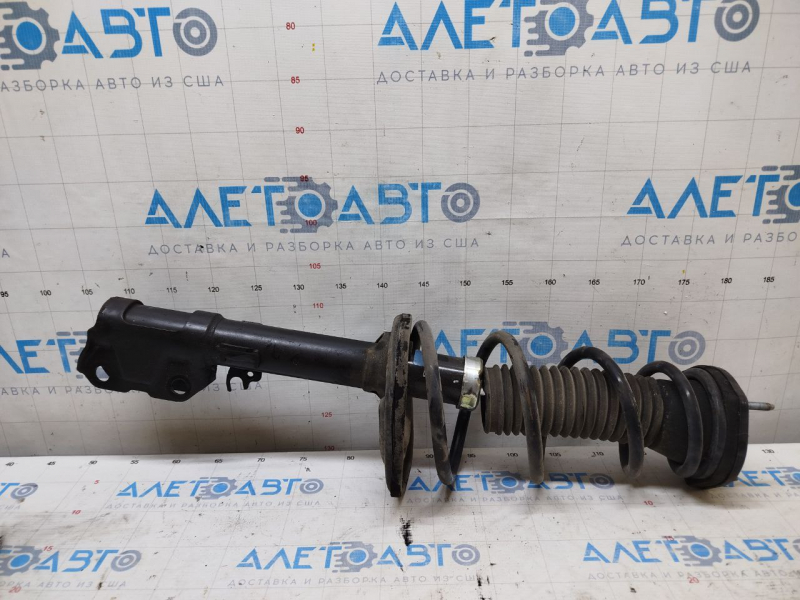 Стойка амортизатора в сборе задняя левая Toyota Camry v50 13-14 usa LE