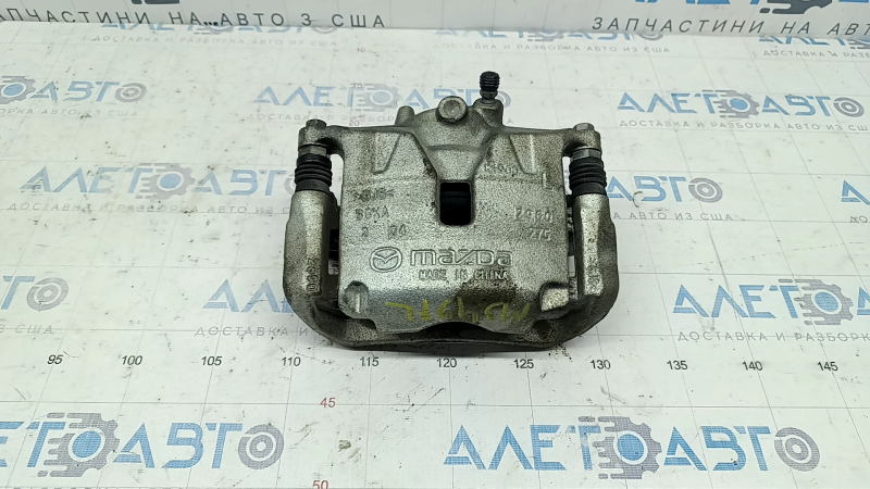 Суппорт в сборе передний левый Mazda 3 19-26 FWD Japan built