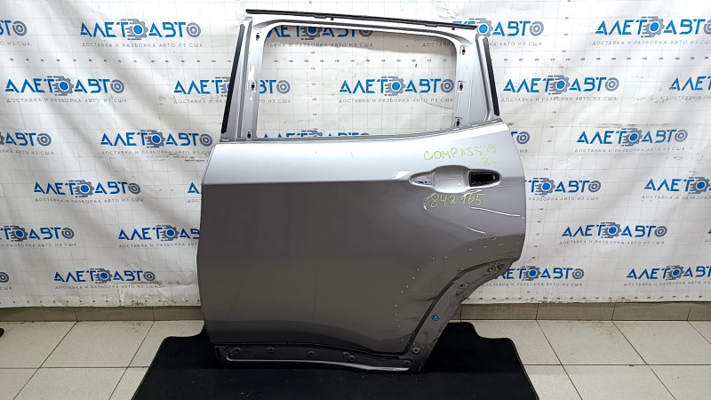 Дверь голая задняя левая Jeep Compass 17-26 серебро PSC, тычки, примята