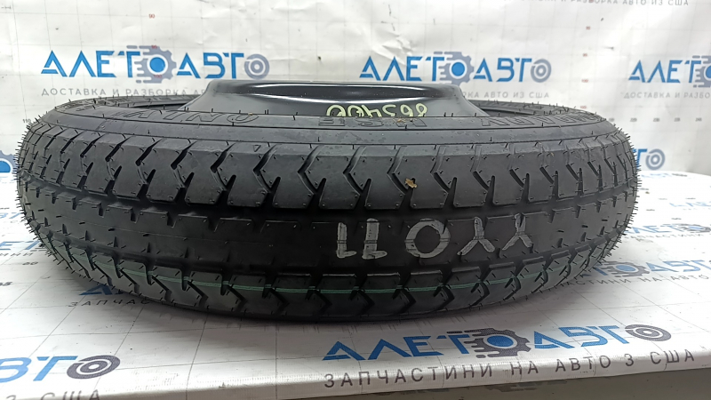 Протектор запаса колеса для Toyota Camry, видно состояние и маркировка.