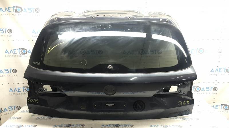 Дверь багажника BMW X5 G05 2019-2026, вид снаружи с небольшими царапинами на стекле.
