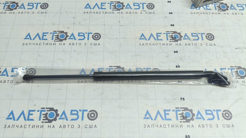 Амортизатор дверей багажника лівий Mazda CX-7 07-12