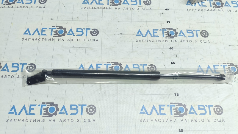 Амортизатор дверей багажника лівий Mazda CX-7 07-12